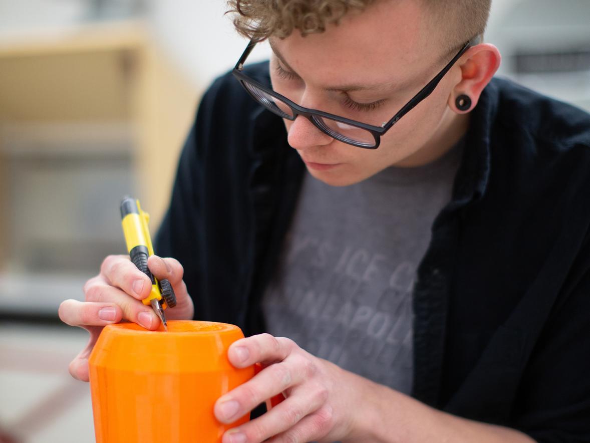 A UW-Stout student works on a project in the ceramics lab.