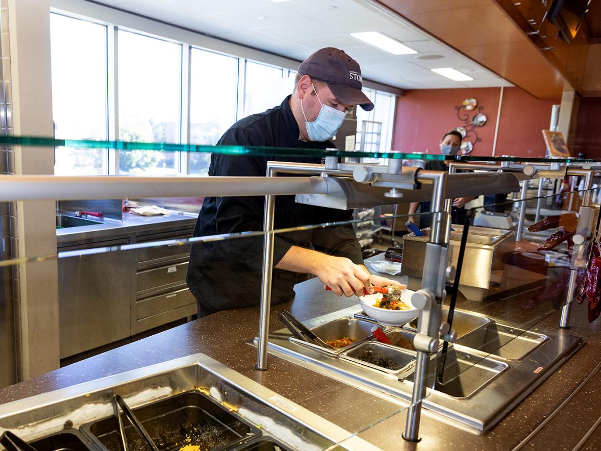 Merle M. Price Commons Executive Chef Matt Wormer dishes up a meal at the Commons.