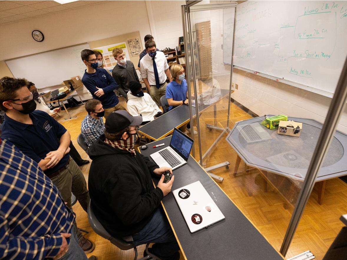 During the competition, students encourage each other and laugh as their bots lost, or lose parts.