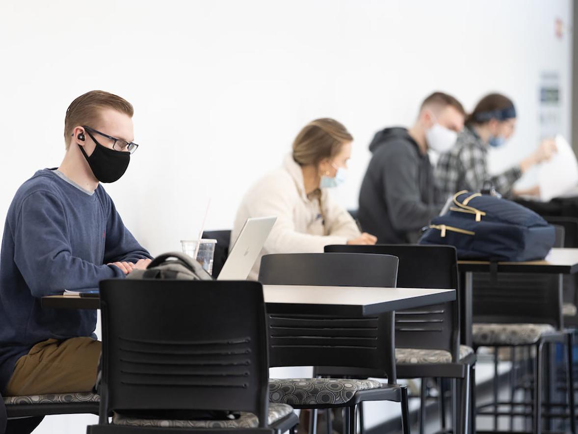 Students wear masks in a study area recently at UW-Stout. 