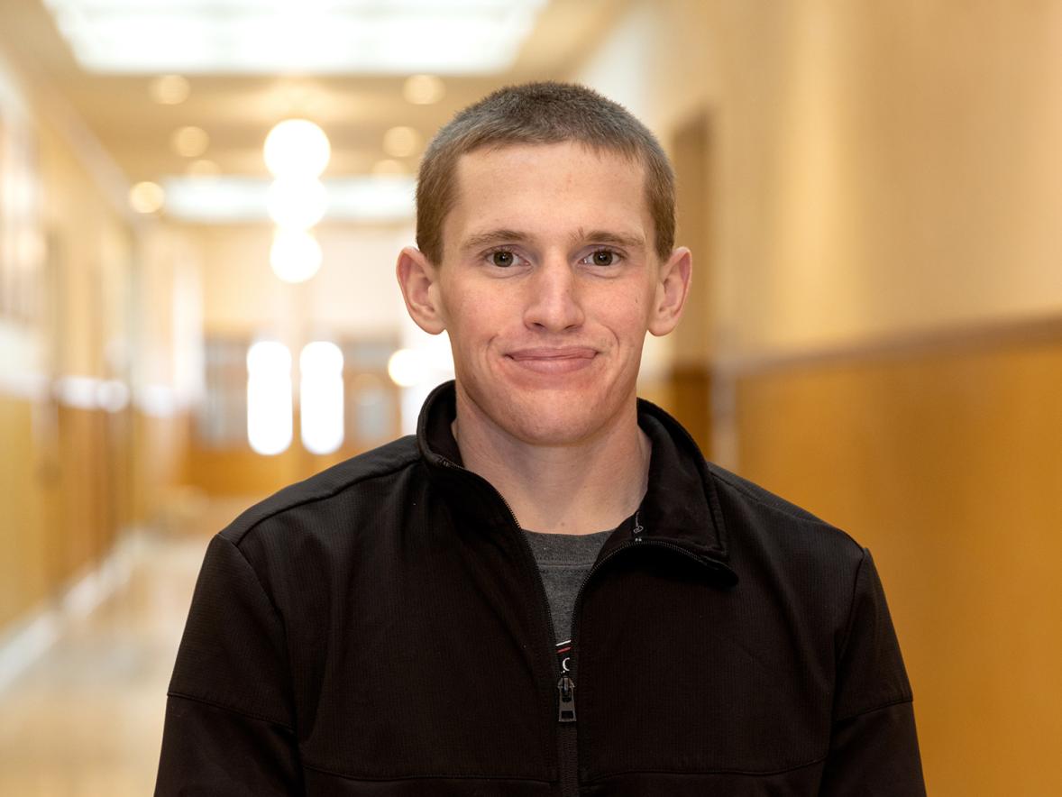 DJ Walker, a junior from Menomonie in the applied social science program, is presenting the results of his research at the annual Research in the Rotunda event March 9 at the Capitol in Madison.