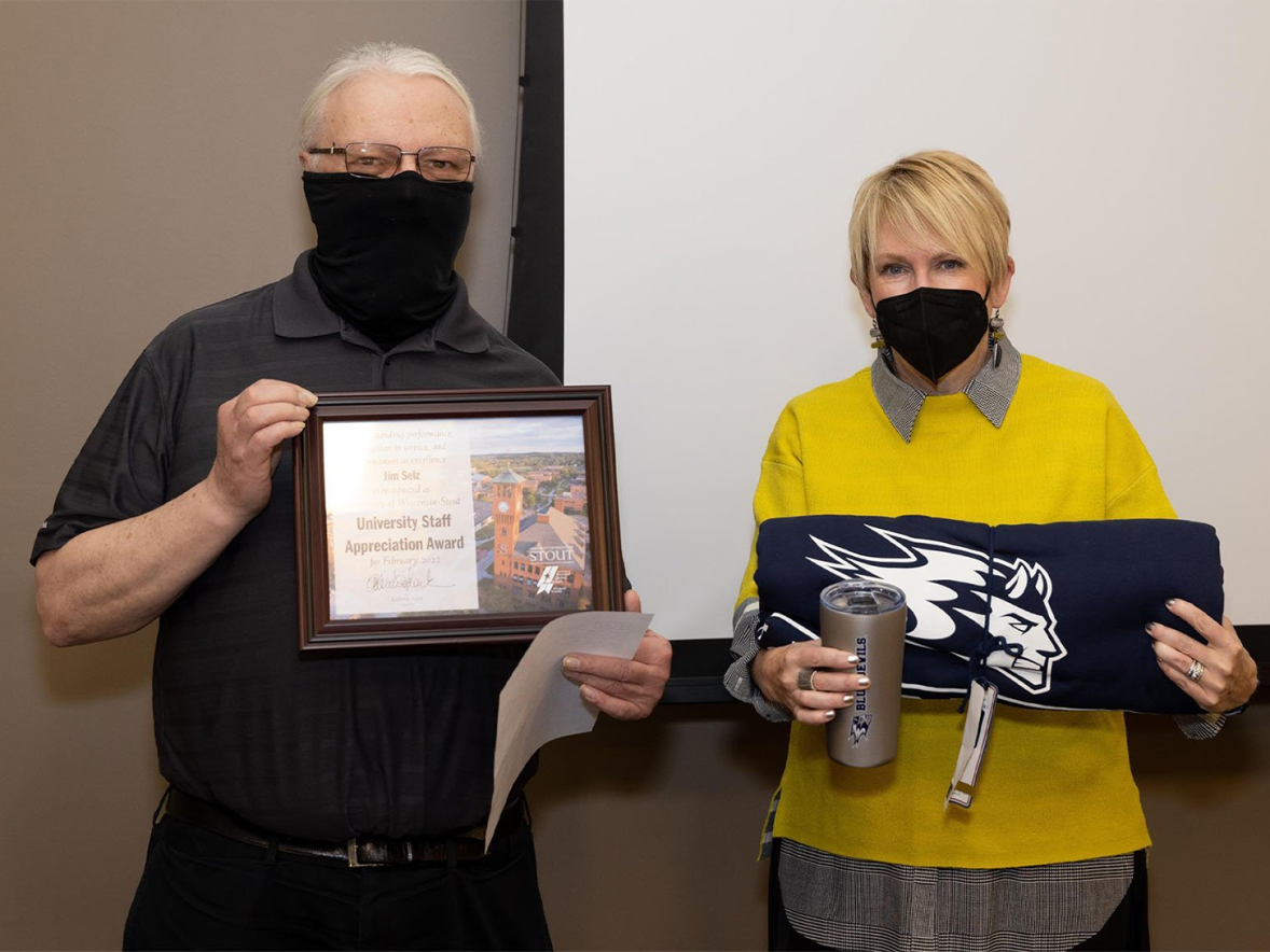 Jim Selz receives the February University Staff Appreciation Award from Chancellor Katherine Frank.