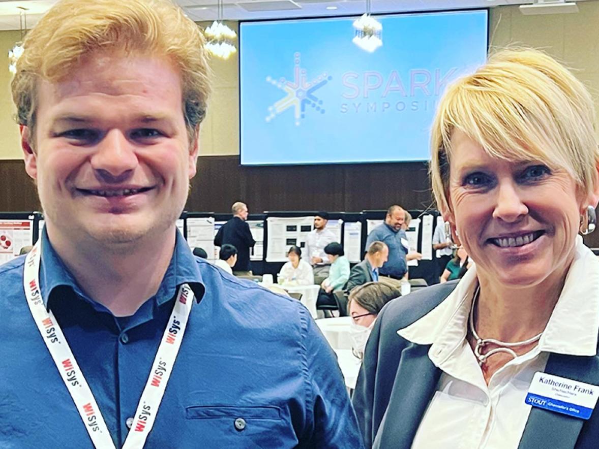 Josh Bernin of UW-Stout, with Chancellor Katherine Frank, took second place in the WiSys Quick Pitch state finals held at UW-La Crosse.