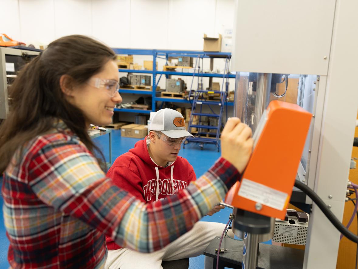 Plastics engineering students work in the lab.