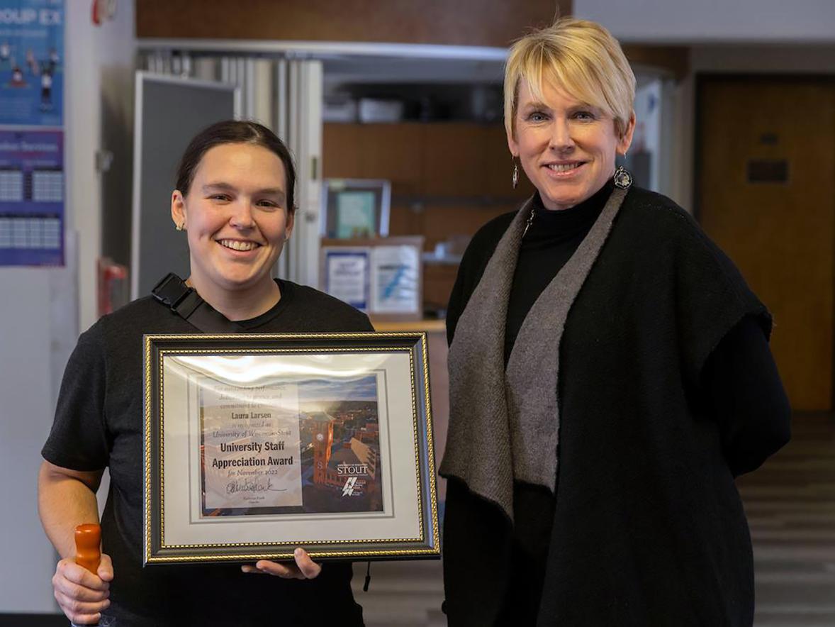 Laura Larsen, left, receives the November University Staff Employee Appreciation Award from Chancellor Katherine Frank.