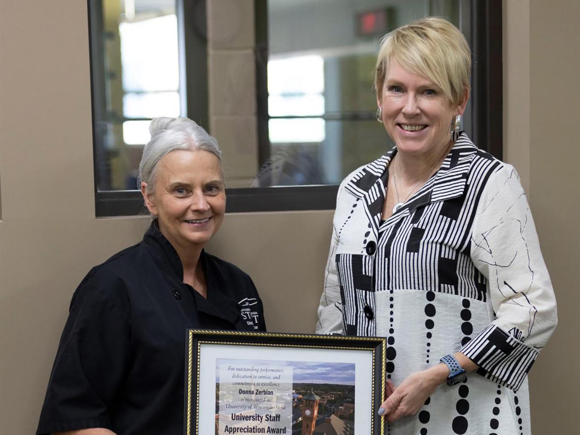 Donna Zerbian, left, receives the May University Staff Employee Appreciation award from Chancellor Katherine Frank.