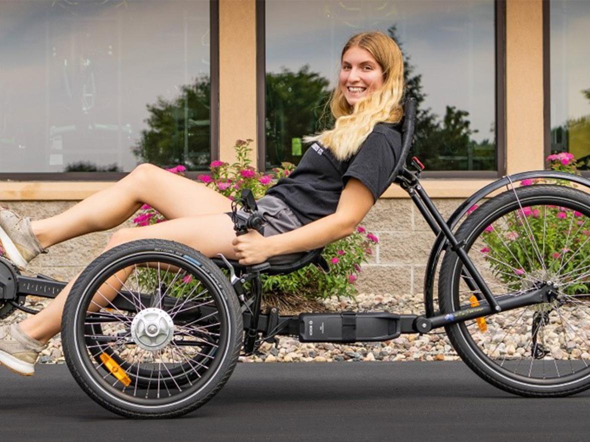 MBE student Mikayla Obsuszt on a bike at the Hostel Shoppe