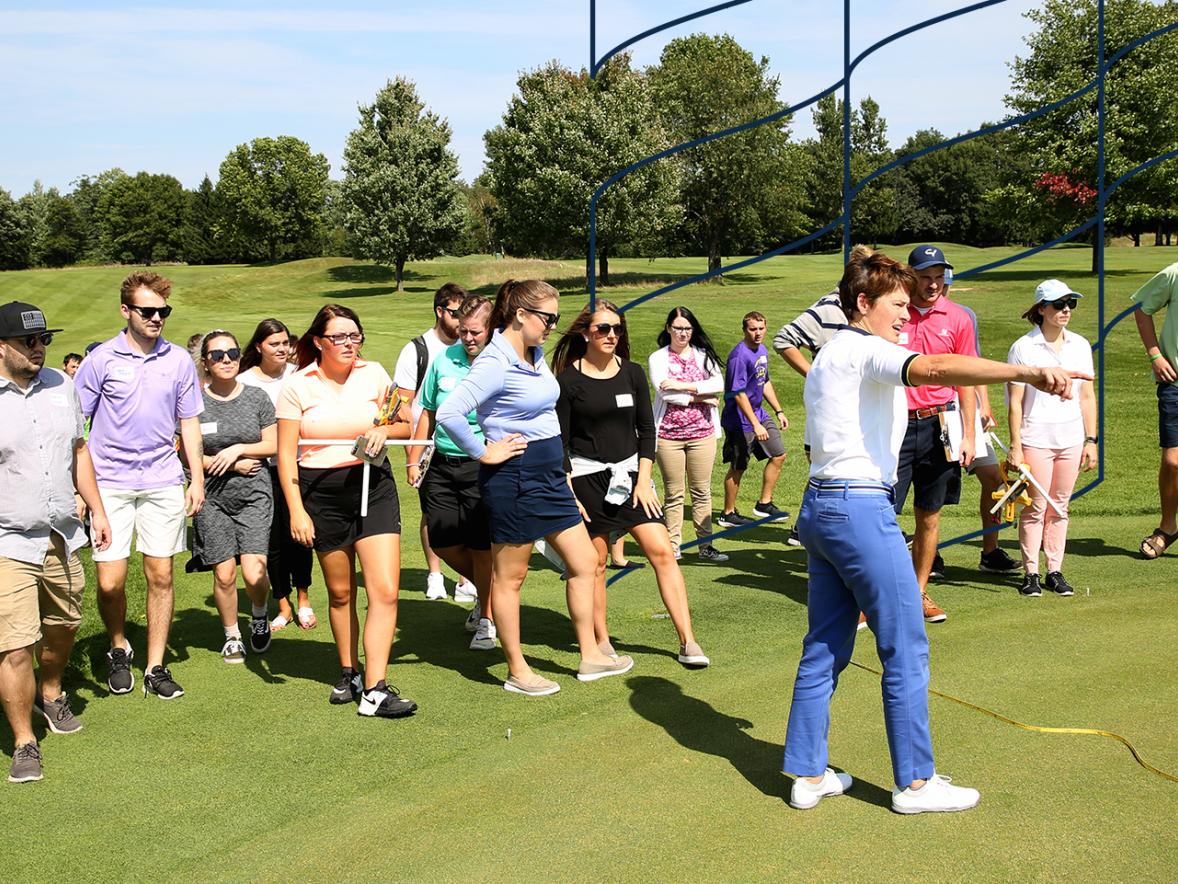 Student in the golf management program perform hands on learning.