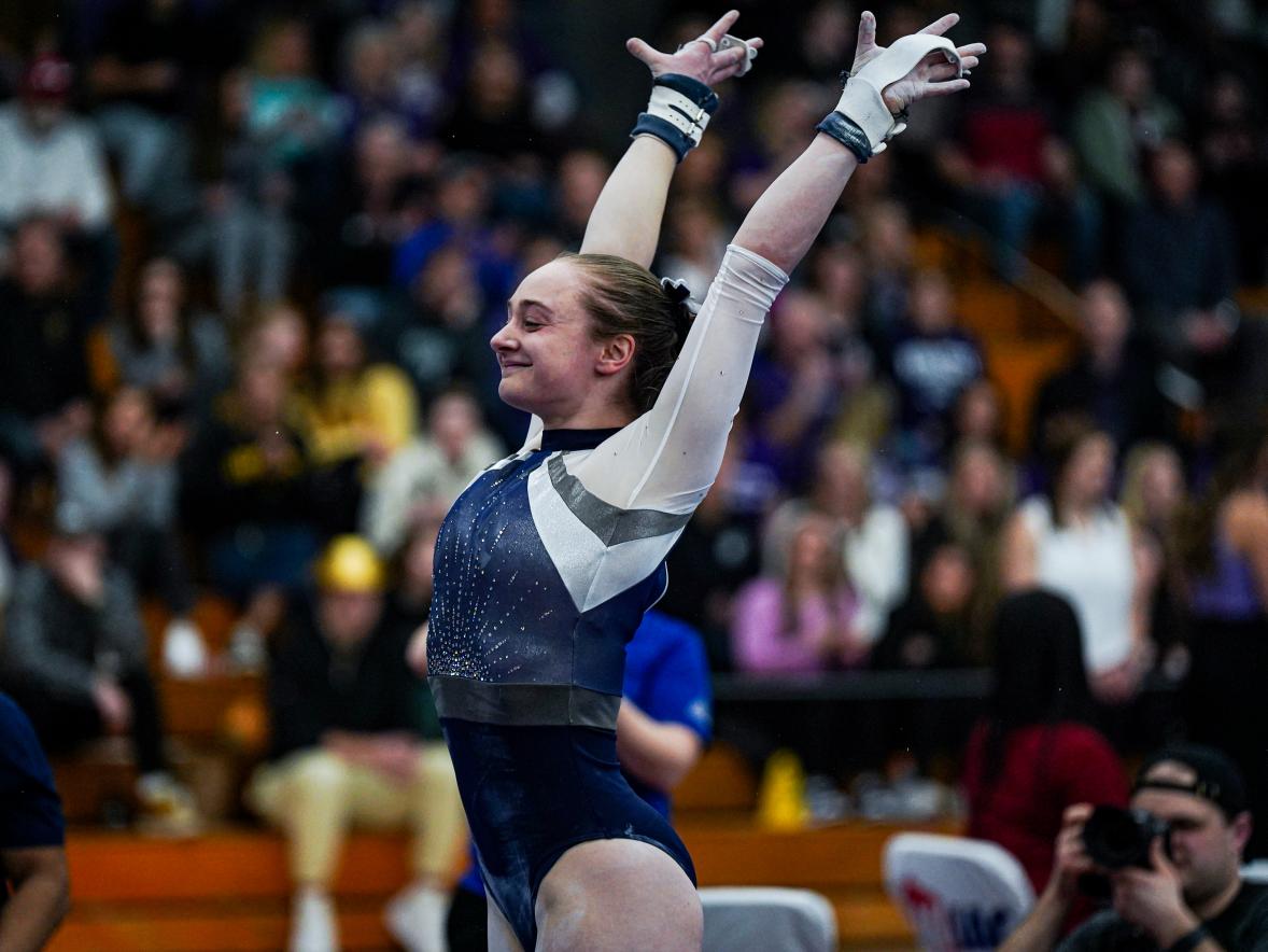 Effie Ferguson completes a routine at the WIAC/regional meet at Hamline University. She tied for first on the balance beam.