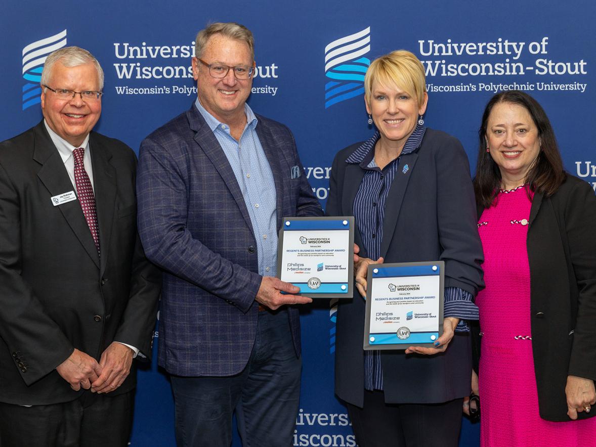 The UW Regents Business Partnership Award presentation Feb. 27 at UW-Stout included, from left, UW President Jay Rothman, Phillips-Medisize Vice President of Global Operations Dave Thoreson, UW-Stout Chancellor Katherine Frank and Board of Regents President Karen Walsh.