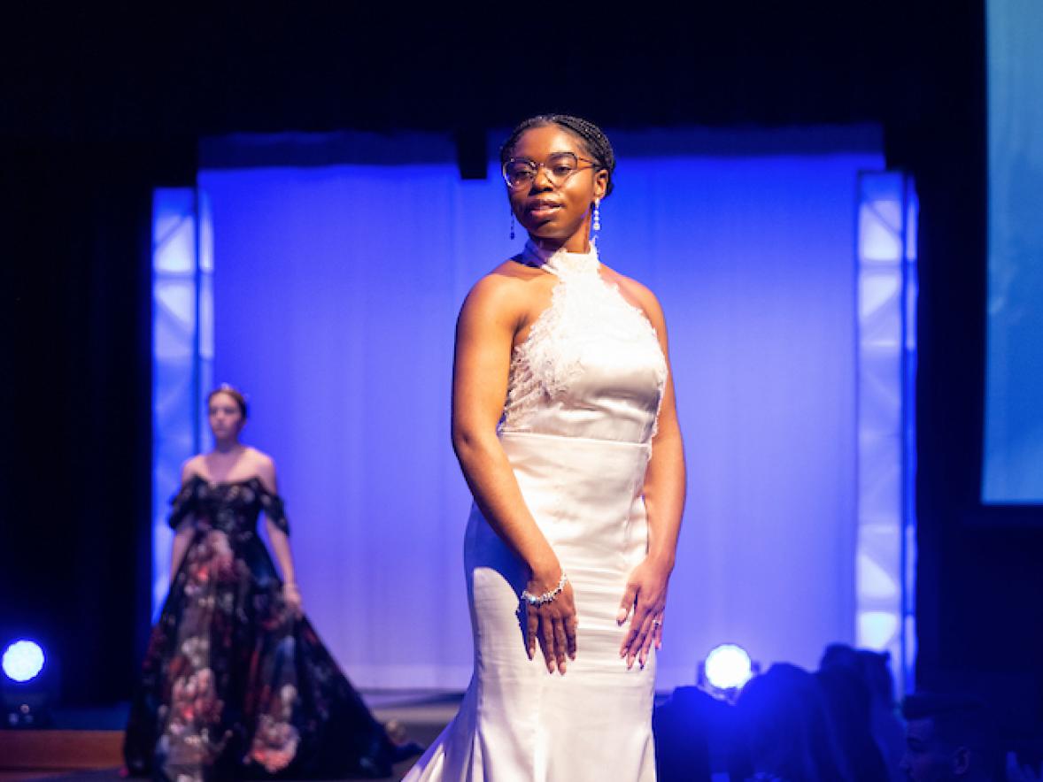 A model on the fashion runway in a bridal gown