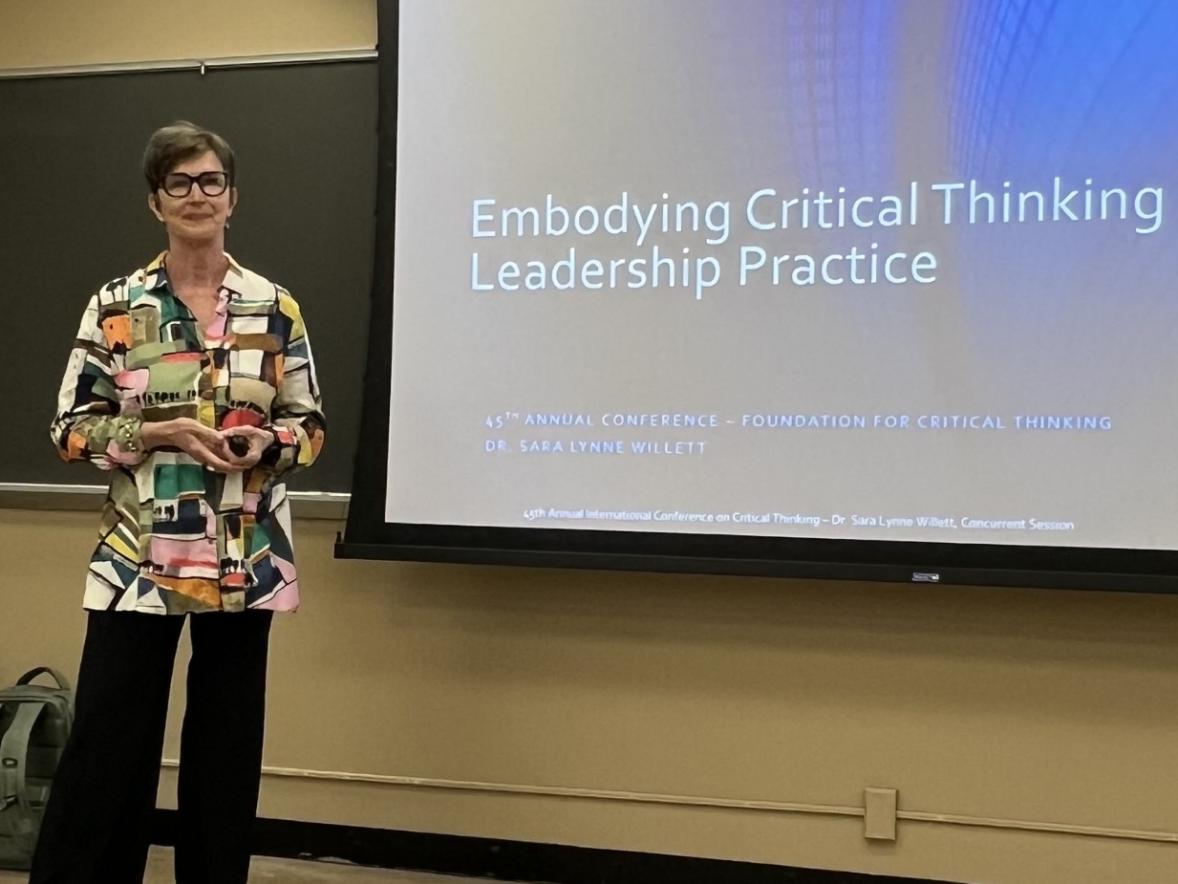 Professor Lynne Willett presents to a room full of attendees at the International Conference on Critical Thinking.
