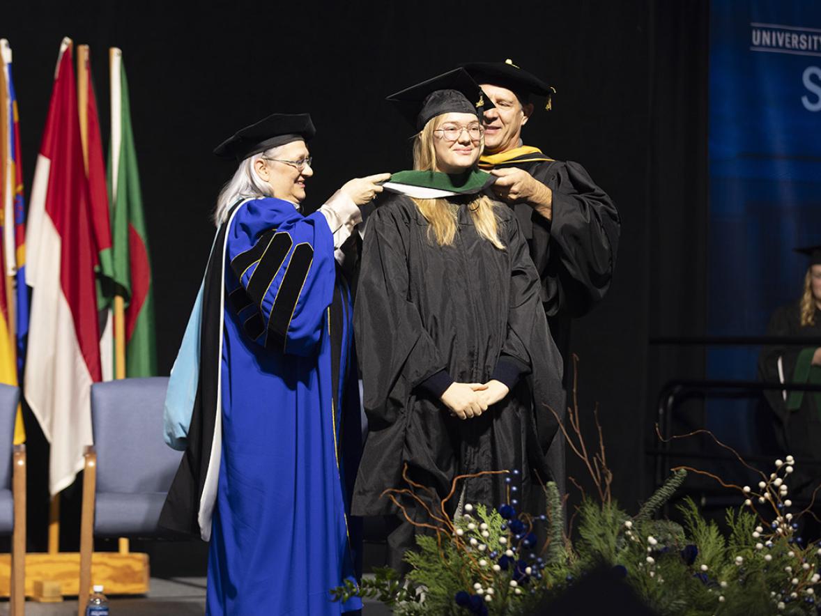 Graduate student receives hood