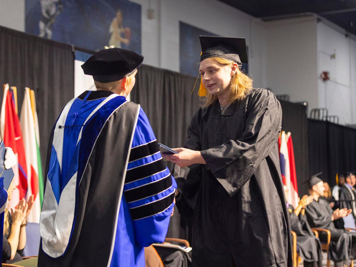 Man receiving diploma