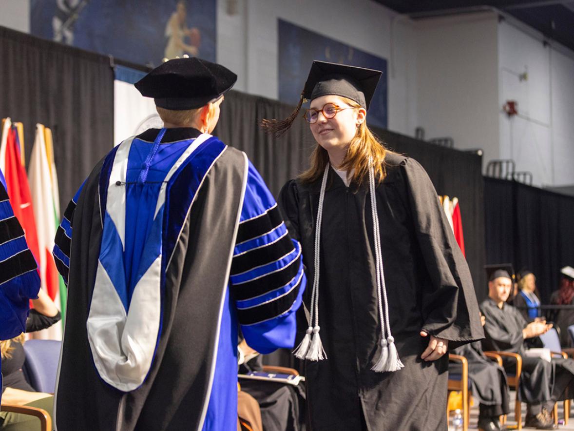 Woman receives diploma