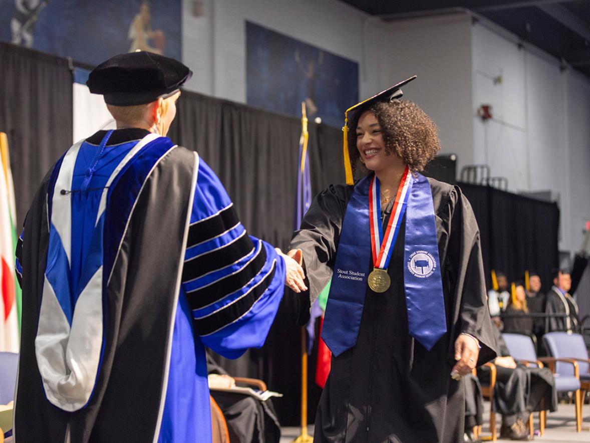 Woman receives college diploma