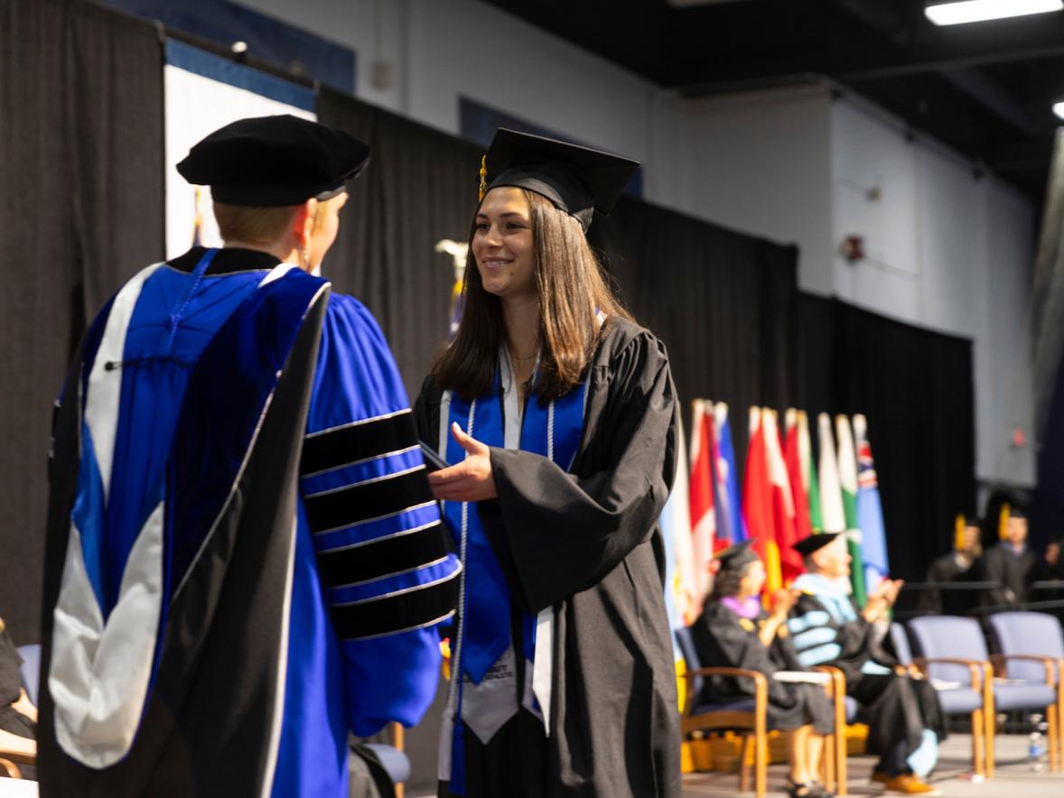 Woman receiving diploma