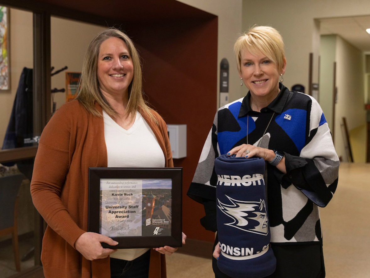 Two women with award