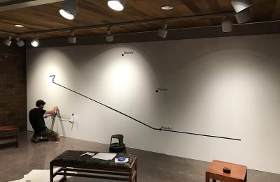 The exhibit features a map. The tags will be hung where the remains of migrants were found.