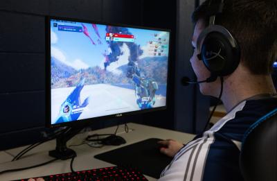 UW-Stout esports team players compete from their new arena in Heritage Hall. The arena includes new computers, monitors and chairs that are standard in competitive gaming.