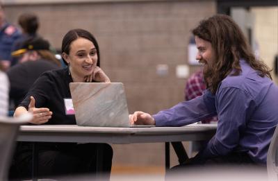 Students meet with professionals at Portfolio Review Day.