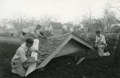 Black and white image of student carpenters