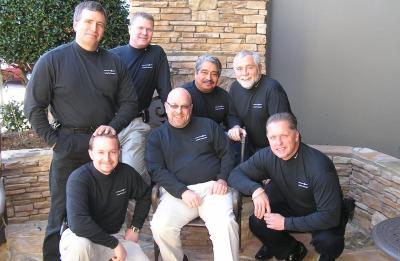 Dave Rasmussen poses with colleagues from International Paper's Continuous Improvement Group during a team gathering.