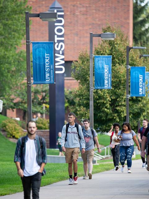 Students walking on campus on the first day of classes