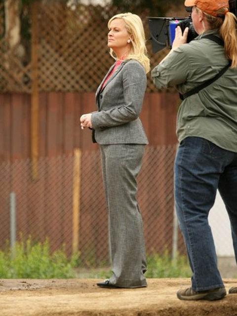 Woman points camera at second woman